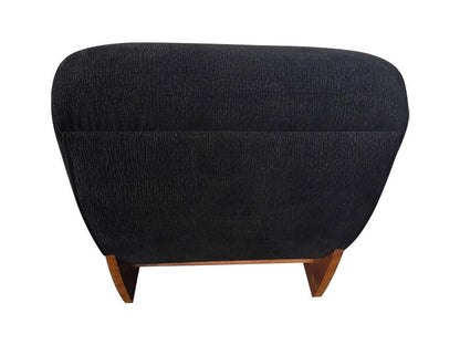 Serino black textured lounge chair with reclined profile and wood frame